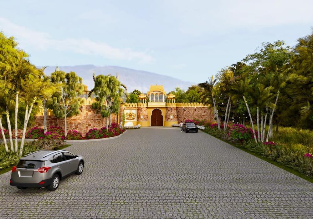 Sonagarh Fort Resort — Cobblestone entrance driveway lined with flowers